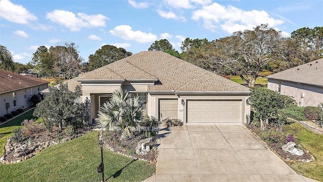 single story home with driveway, a garage, stucco siding, roof with shingles, and a front yard