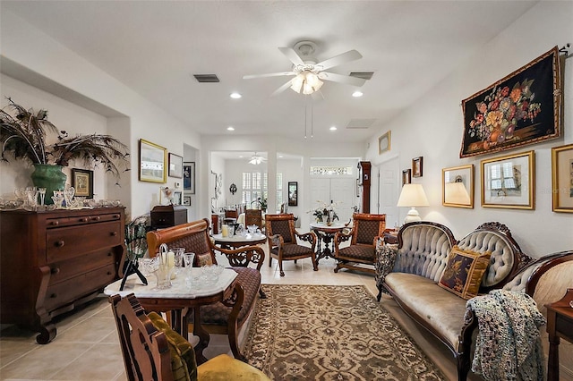 living area with a ceiling fan, recessed lighting, visible vents, and light tile patterned floors