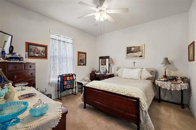 bedroom with ceiling fan and light colored carpet