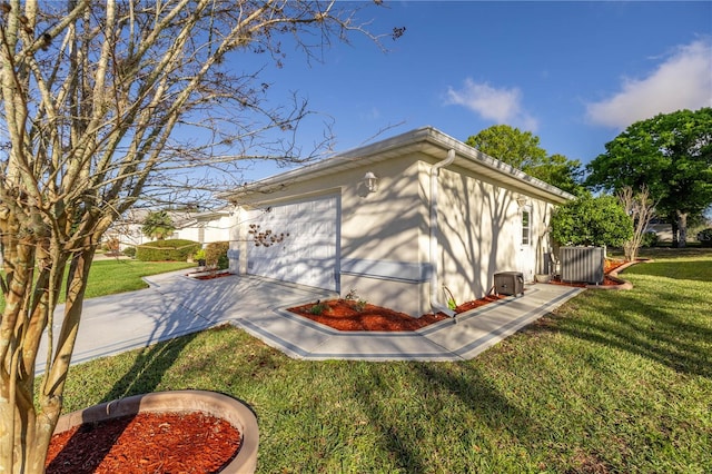 garage with a lawn and central AC