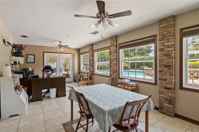 dining space with a wealth of natural light, french doors, and visible vents