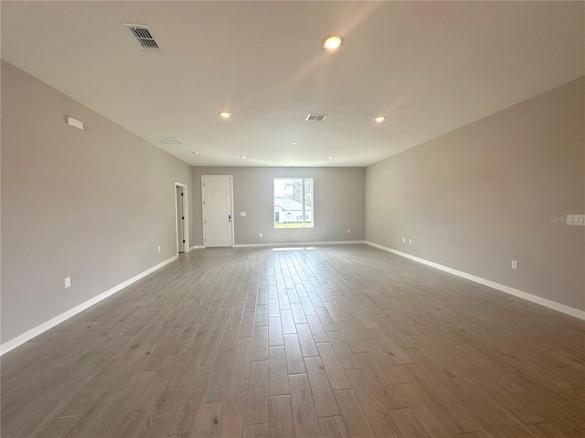 empty room featuring hardwood / wood-style flooring