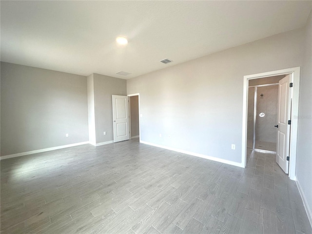 empty room featuring wood-type flooring