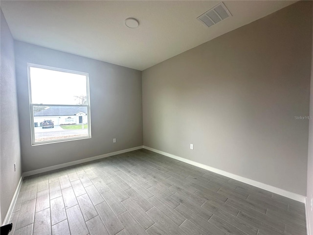 empty room with wood-type flooring