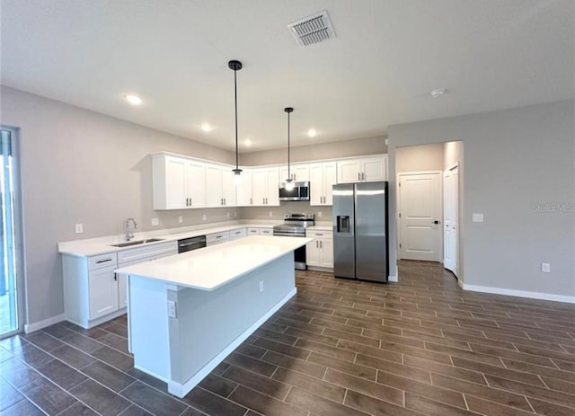 4501 SW 110th Ln, Ocala, FL 34476 - kitchen featuring stainless steel appliances, light countertops, recessed lighting, white cabinets, and wood finish floors