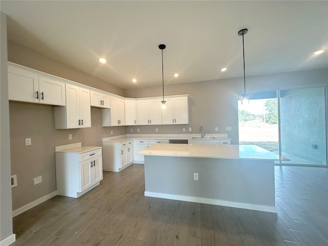 4501 SW 110th Ln, Ocala, FL 34476 - kitchen featuring a kitchen island, wood finished floors, white cabinetry, recessed lighting, and hanging light fixtures