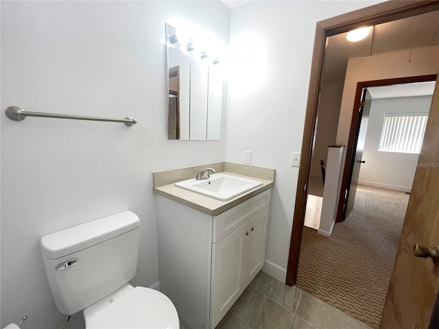 bathroom with toilet and vanity