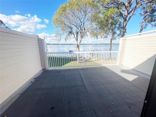 view of patio with a water view