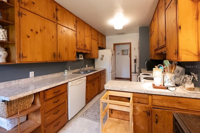 kitchen with sink and white appliances