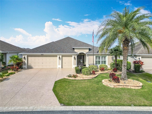 single story home featuring a garage, driveway, roof with shingles, stucco siding, and a front lawn