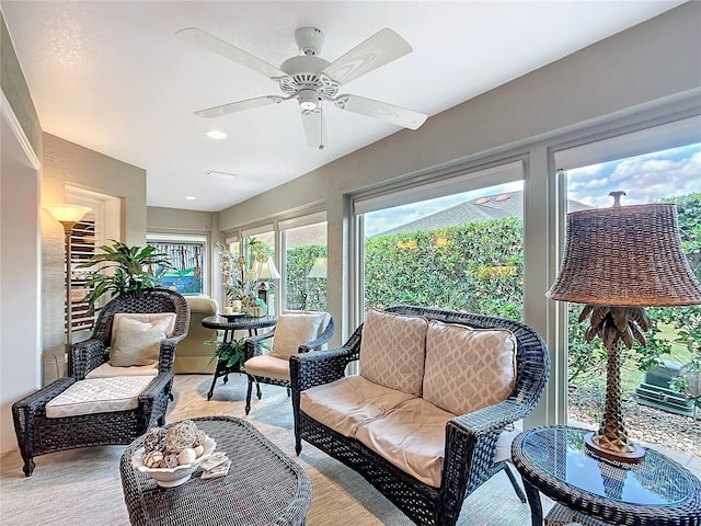 sunroom / solarium featuring a ceiling fan