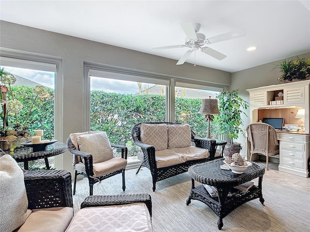 living area featuring a ceiling fan and recessed lighting