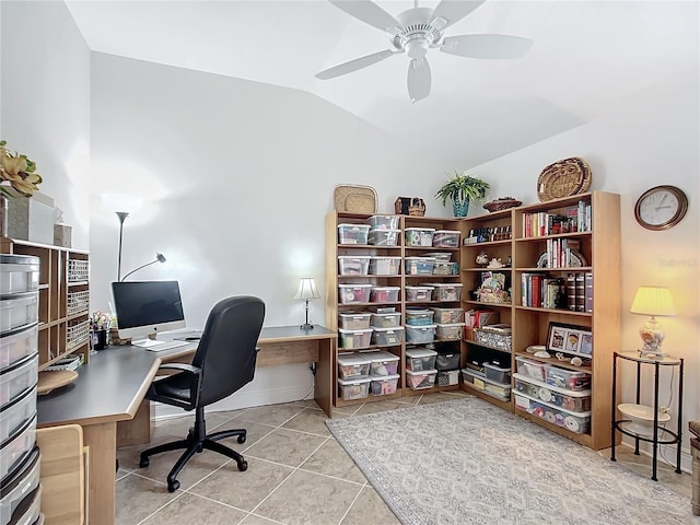 office space featuring a ceiling fan, lofted ceiling, and light tile patterned floors