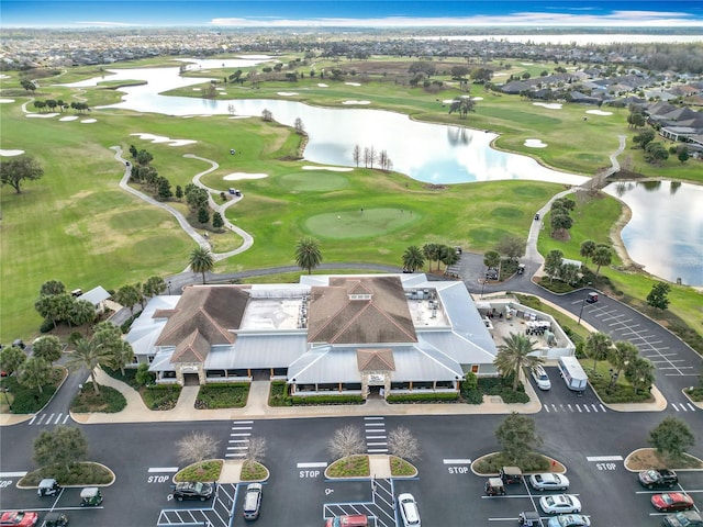 birds eye view of property with a residential view, a water view, and golf course view