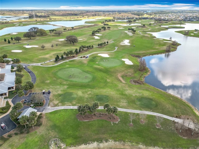 bird's eye view with golf course view and a water view