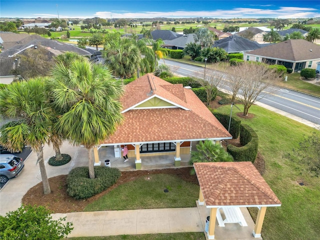 birds eye view of property with a residential view