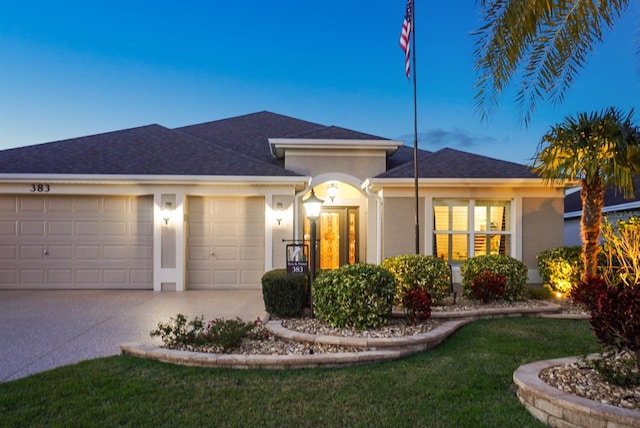 single story home with stucco siding, driveway, a garage, and roof with shingles