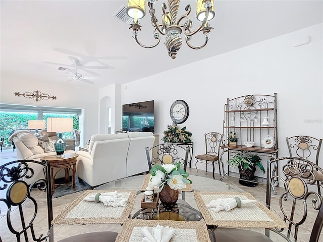 dining space with visible vents and ceiling fan with notable chandelier