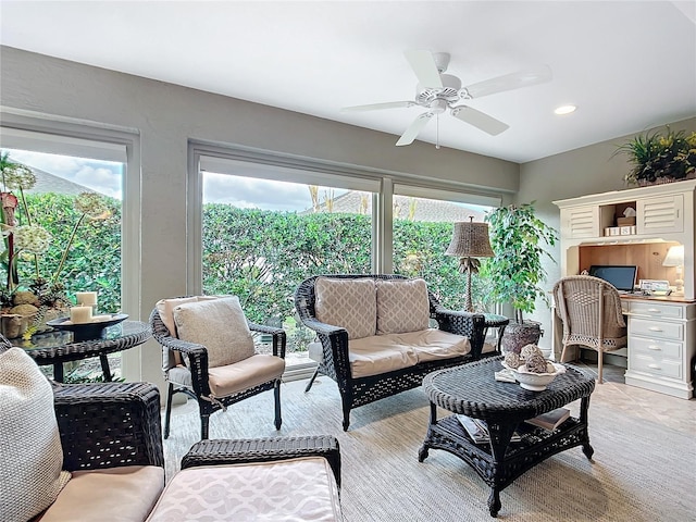 living area with a ceiling fan