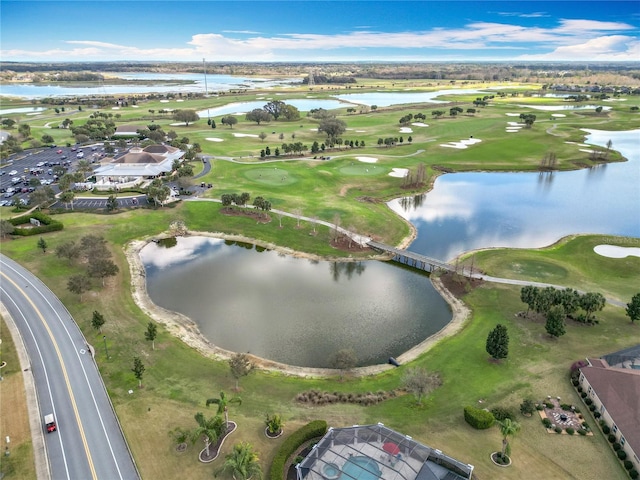 drone / aerial view featuring a water view and view of golf course