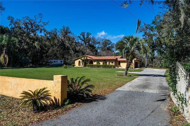 exterior space featuring aphalt driveway