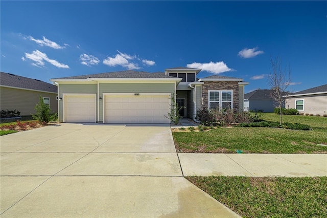 7374 SW 77th Ave, Ocala, FL 34481 - prairie-style house with an attached garage, concrete driveway, a front lawn, and stone siding