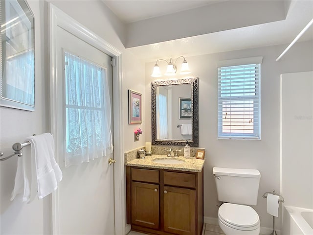 full bathroom with toilet and vanity