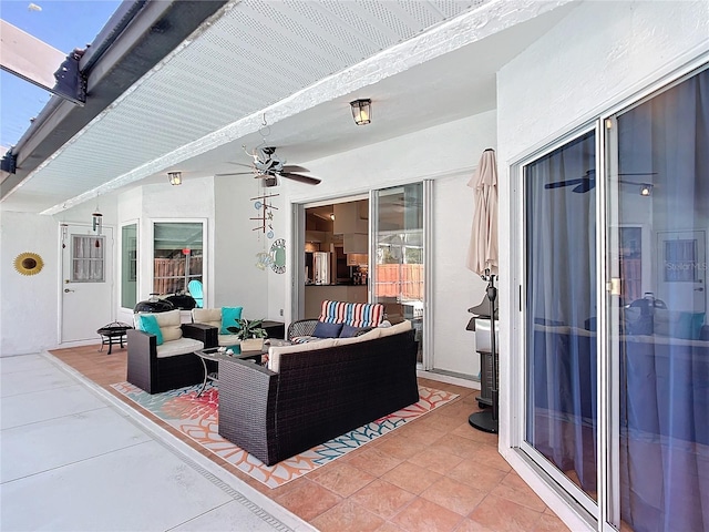 view of patio with a ceiling fan and an outdoor living space