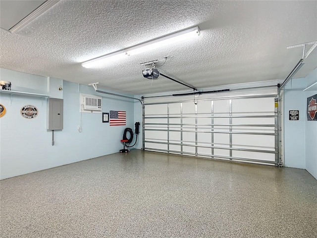 garage featuring a wall mounted AC, electric panel, and a garage door opener