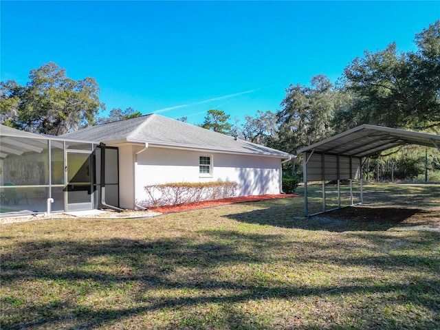 view of side of home with a lanai, stucco siding, a carport, and a yard