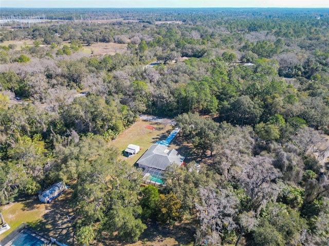 birds eye view of property with a forest view