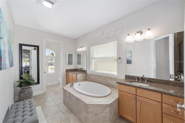 full bathroom with tile patterned flooring, toilet, two vanities, a sink, and visible vents