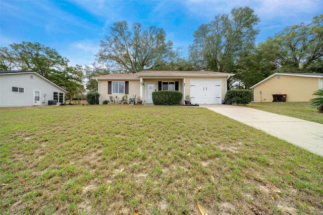 single story home with concrete driveway, a front lawn, and a garage