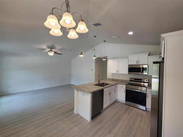 kitchen featuring a sink, visible vents, white cabinets, hanging light fixtures, and appliances with stainless steel finishes