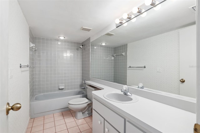 bathroom with visible vents, toilet, shower / tub combination, tile patterned floors, and vanity