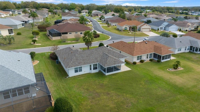 birds eye view of property with a residential view