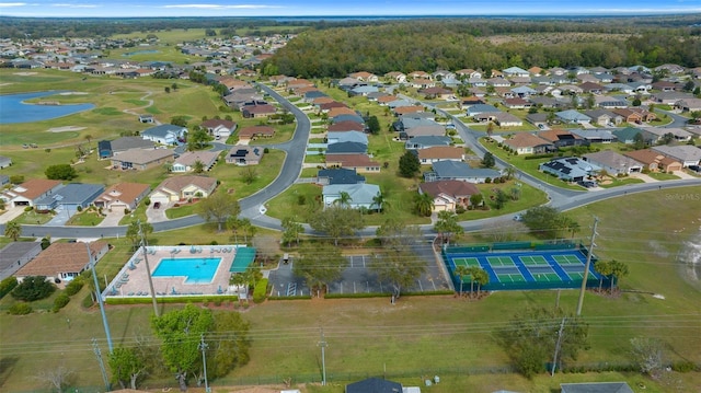 drone / aerial view with a water view and a residential view