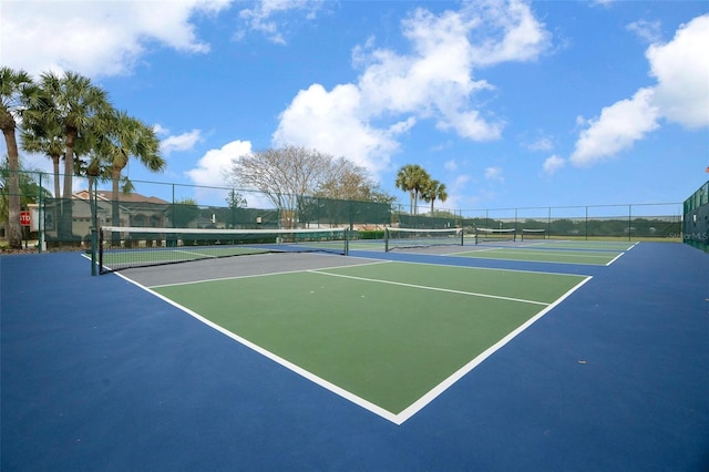 view of sport court with fence