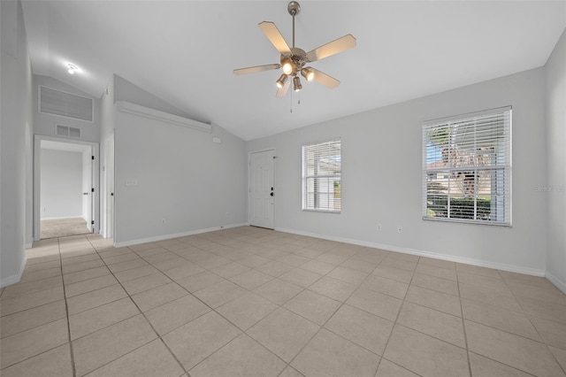 spare room with light tile patterned floors, baseboards, visible vents, a ceiling fan, and high vaulted ceiling