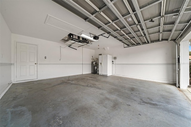 garage featuring white fridge with ice dispenser, water heater, and a garage door opener