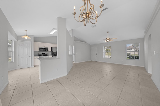 unfurnished living room featuring light tile patterned floors, lofted ceiling, visible vents, baseboards, and ceiling fan with notable chandelier