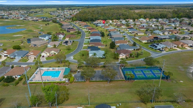 birds eye view of property with a water view and a residential view