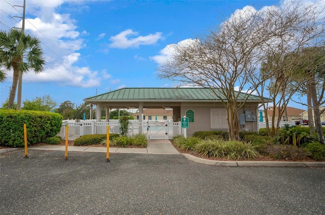 surrounding community featuring fence and a gate