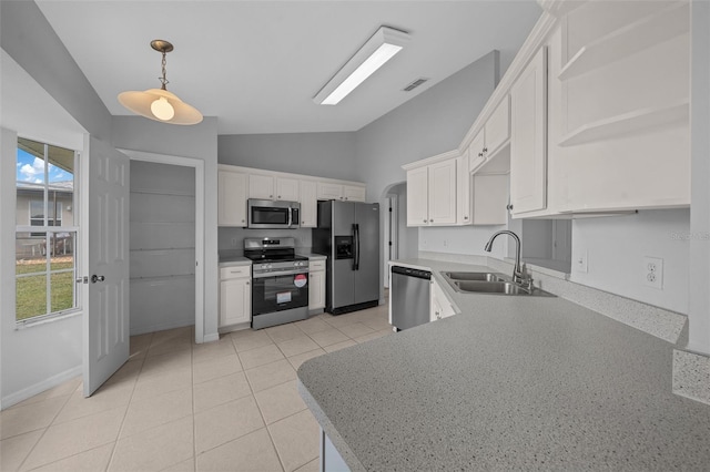 17799 SE 125th Cir, Summerfield, FL 34491 - kitchen with appliances with stainless steel finishes, open shelves, a sink, vaulted ceiling, and white cabinetry