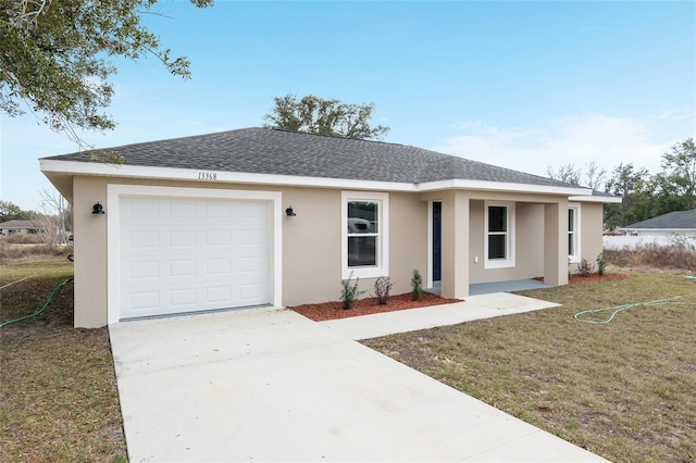 ranch-style house with driveway, stucco siding, a shingled roof, and a front yard