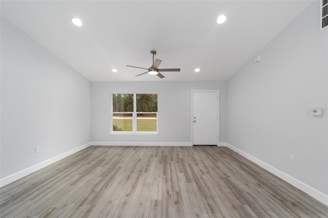 empty room with ceiling fan, light wood finished floors, recessed lighting, and baseboards