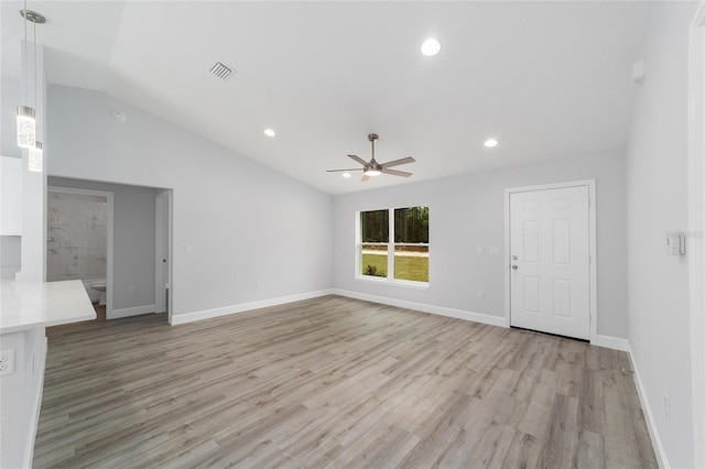 unfurnished living room featuring baseboards, lofted ceiling, ceiling fan, light wood-type flooring, and recessed lighting