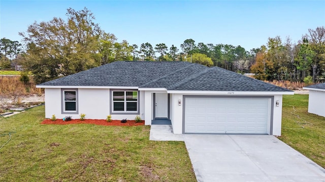 ranch-style home featuring a shingled roof, concrete driveway, an attached garage, a front yard, and stucco siding