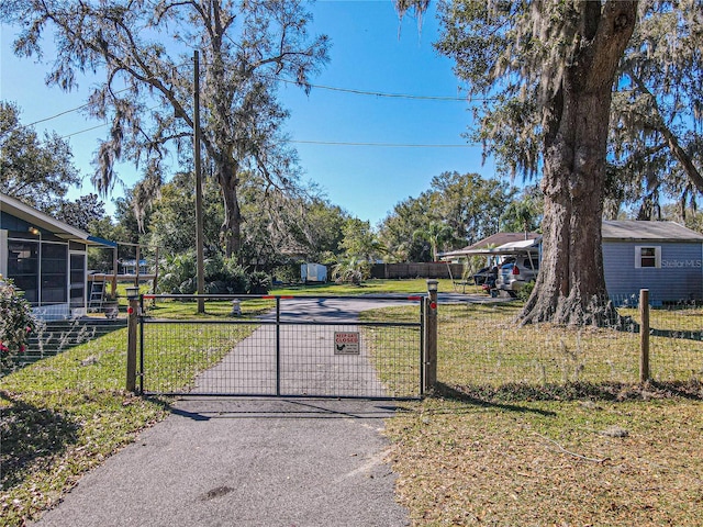 exterior space featuring a lawn and fence