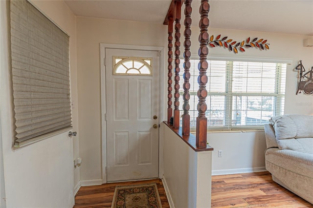 entryway featuring light wood-type flooring and baseboards